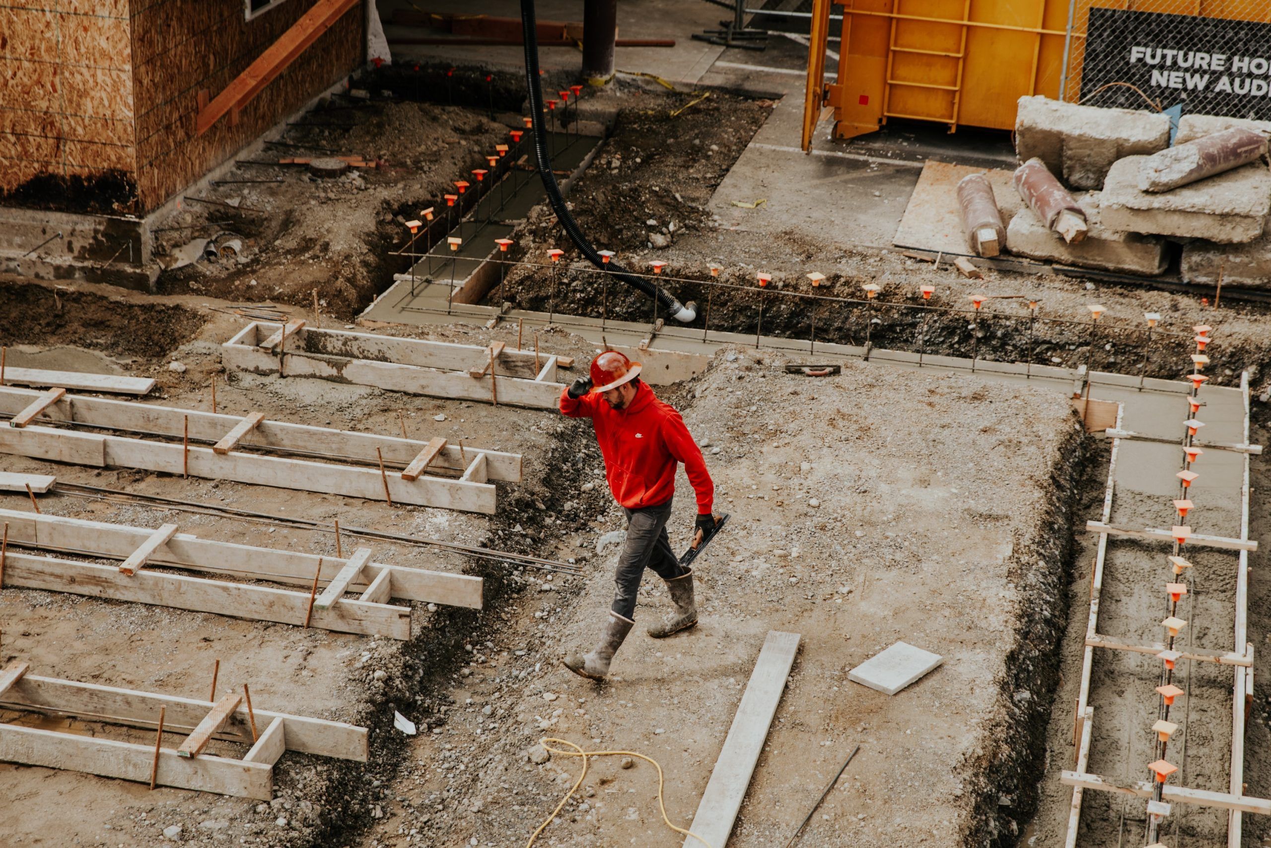 building site with worker in hard hat