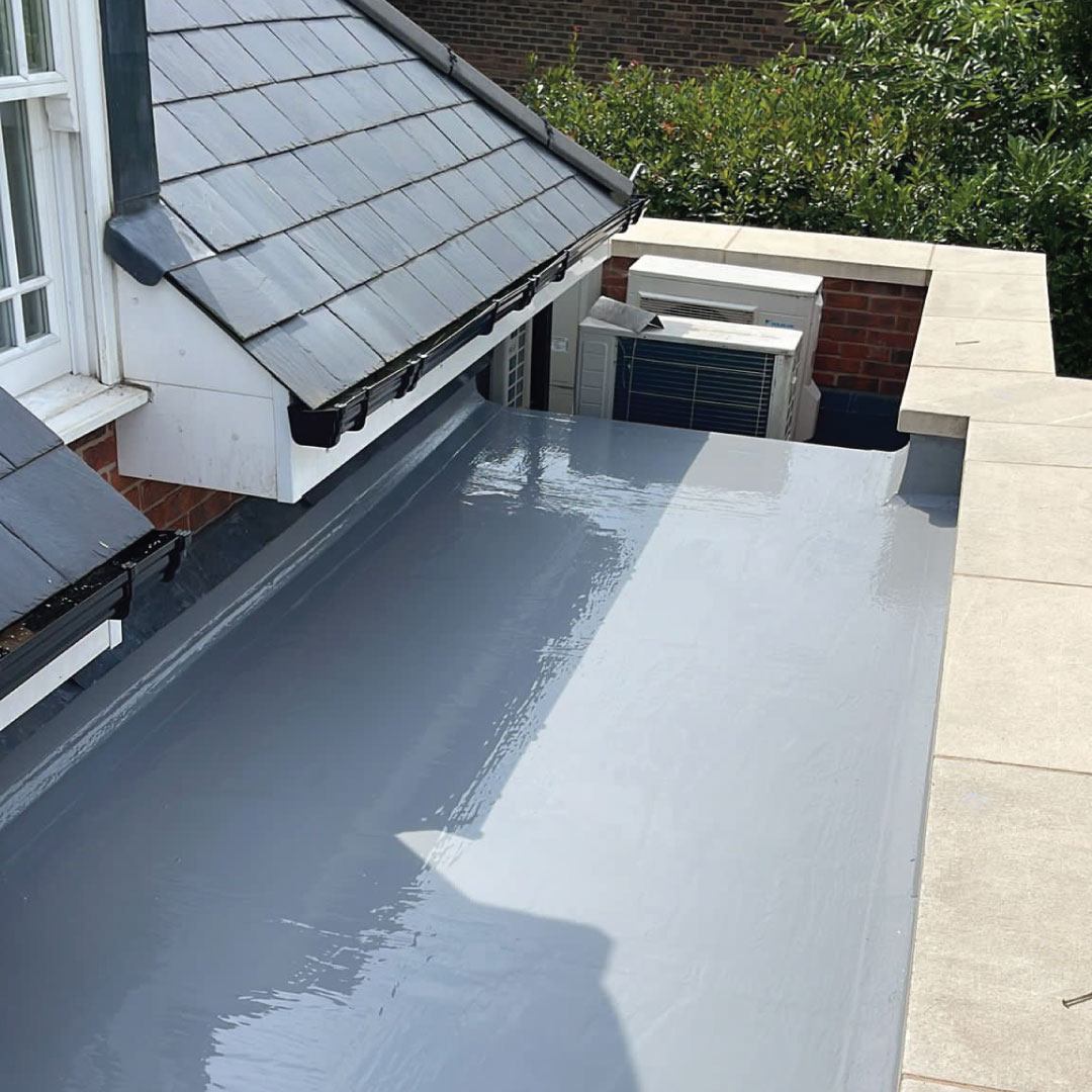 grey liquid waterproofing on flat roof