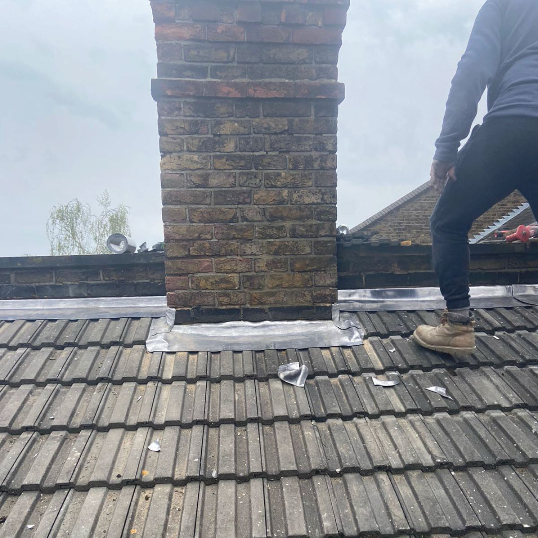 a lead welding installer working on roof