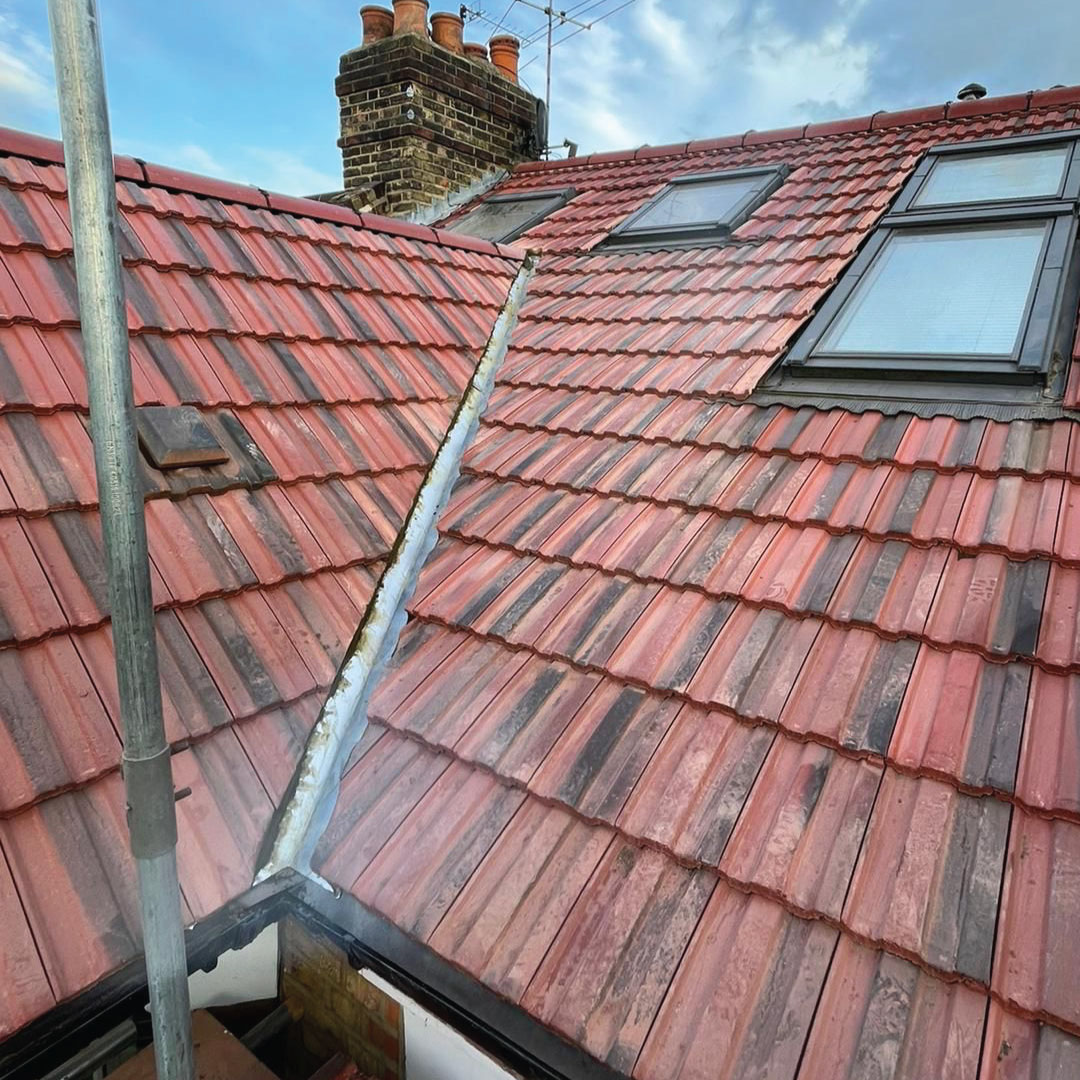 lead valley replacement on red tiled roof