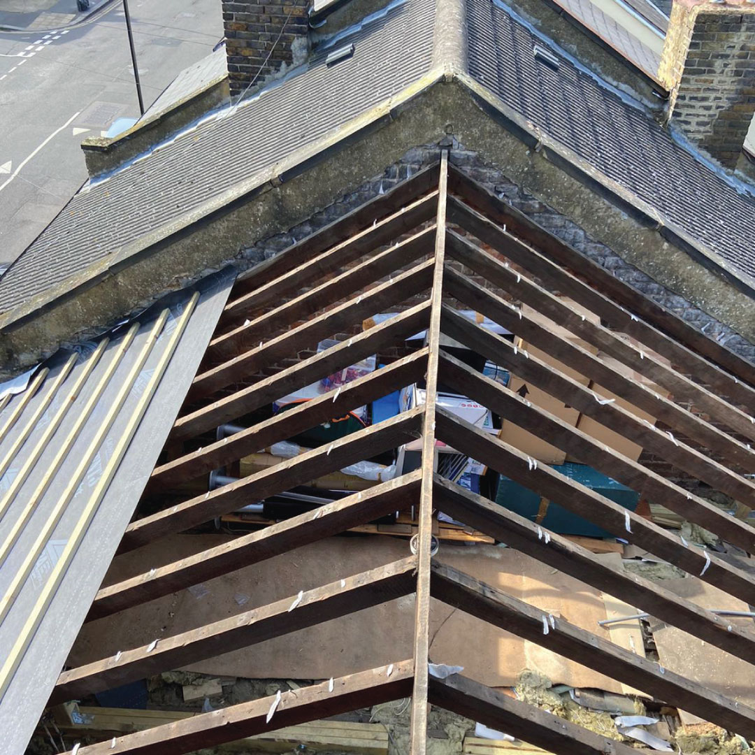 exposed roof beams with new materials partially installed