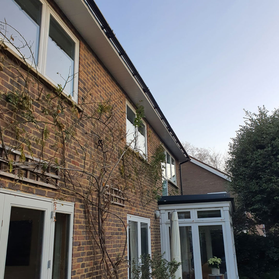 view of gutter repair from back garden