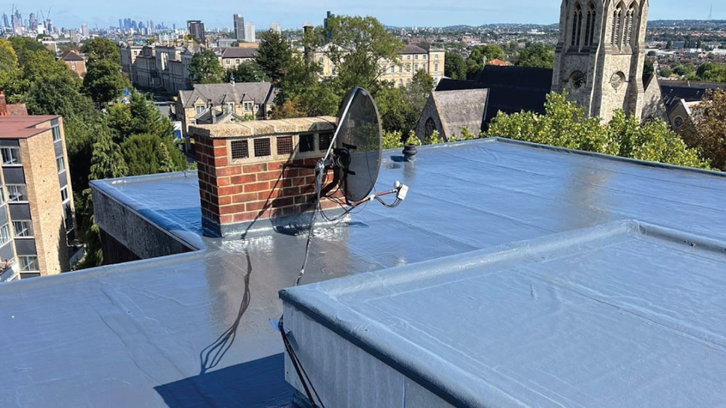 flat roofing installation overlooking old buildings