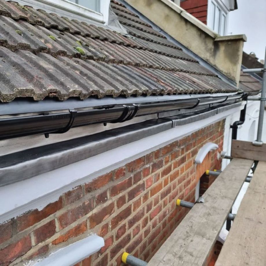 view of scaffolding and roof with capping