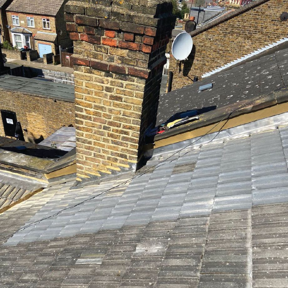 ariel view showing replacemet roof tiles within older tiles